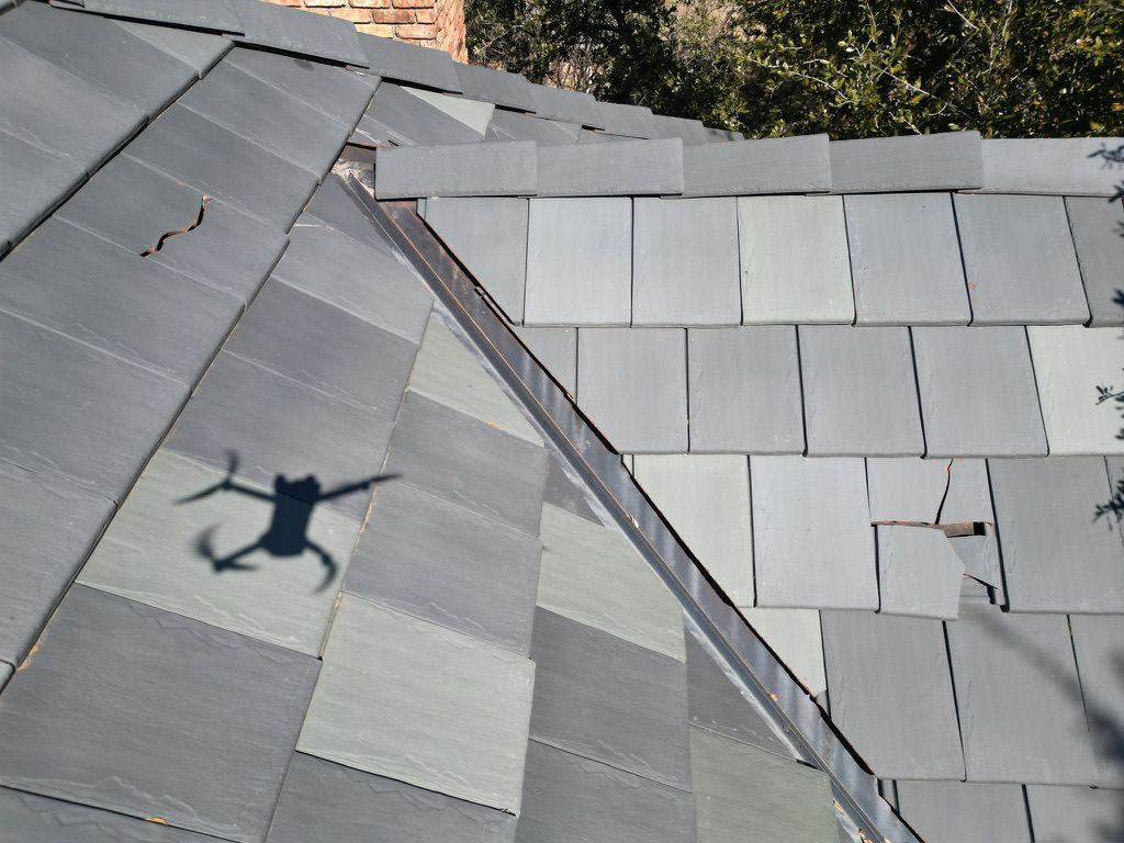 Hail damage to flat tile roof in Dallas, TX